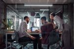 Team Collaboration in a Modern Office with Technical and Digital Discussions