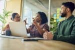 Diverse Professionals Brainstorming Ideas In Modern Office